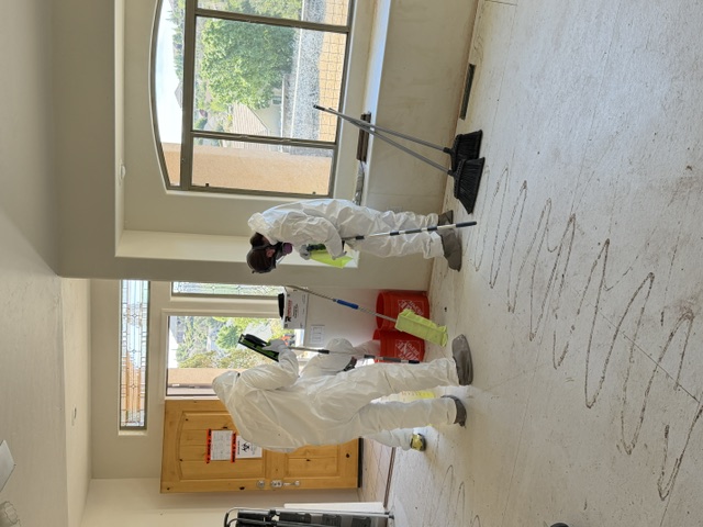 Technicians thoroughly cleaning a property after biohazard remediation in Georgia